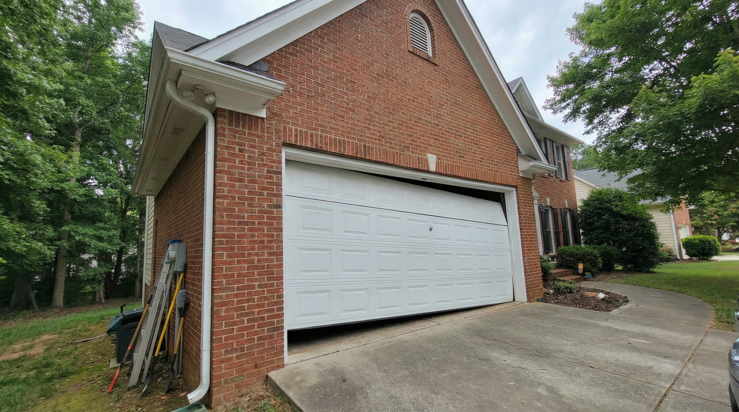 Garage door off track on a brick home in Denver, NC